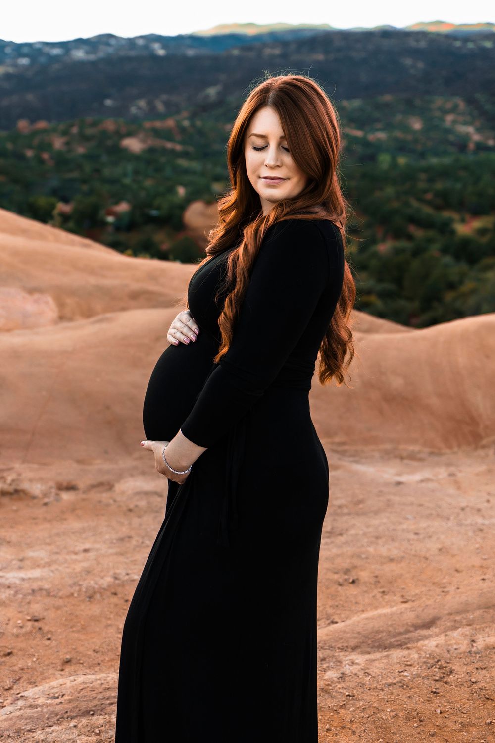 Pregnant woman at maternity photoshoot at garden of the gods