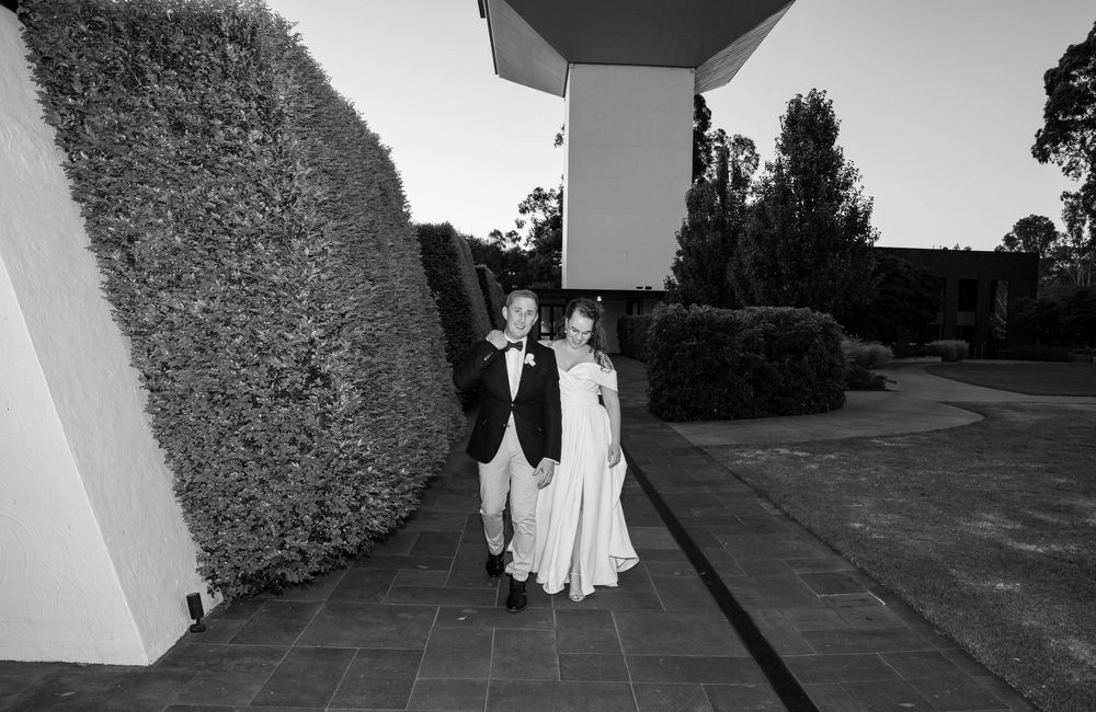 Black and white architectural wedding photographs with geometric shadows and angles.