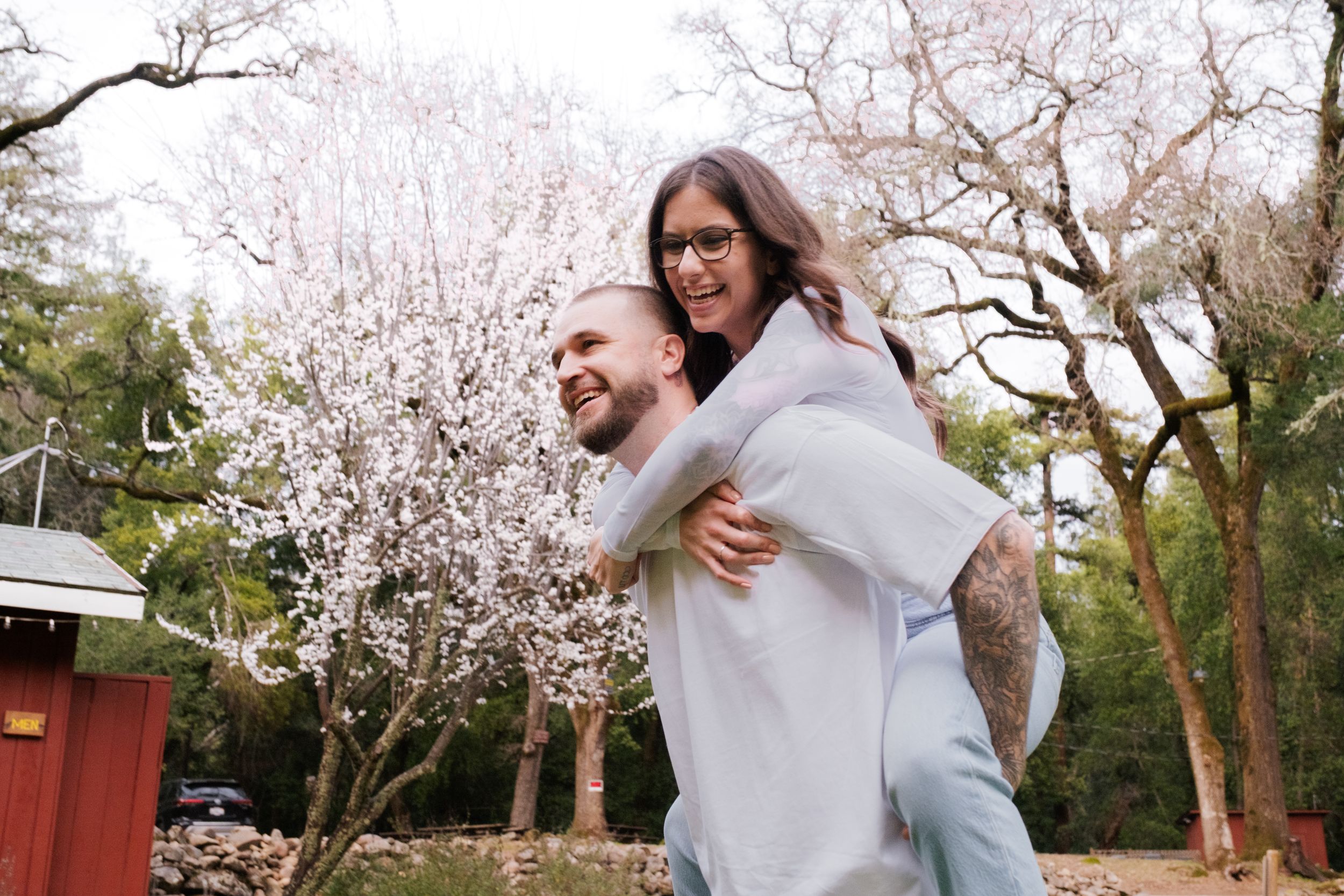 engaged couple piggyback.