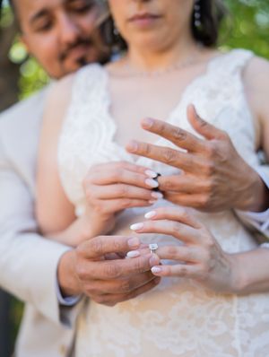 Close-up sequence showing hands exchanging and placing an engagement ring during a romantic proposal moment.