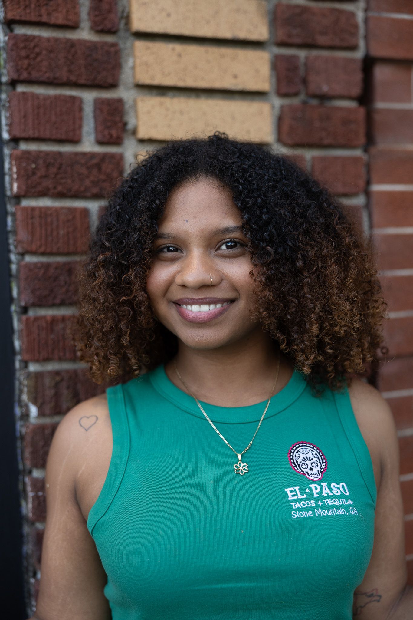 Asheville small business entrepreneur and local restaurant bar posing during a professional branding photography session
