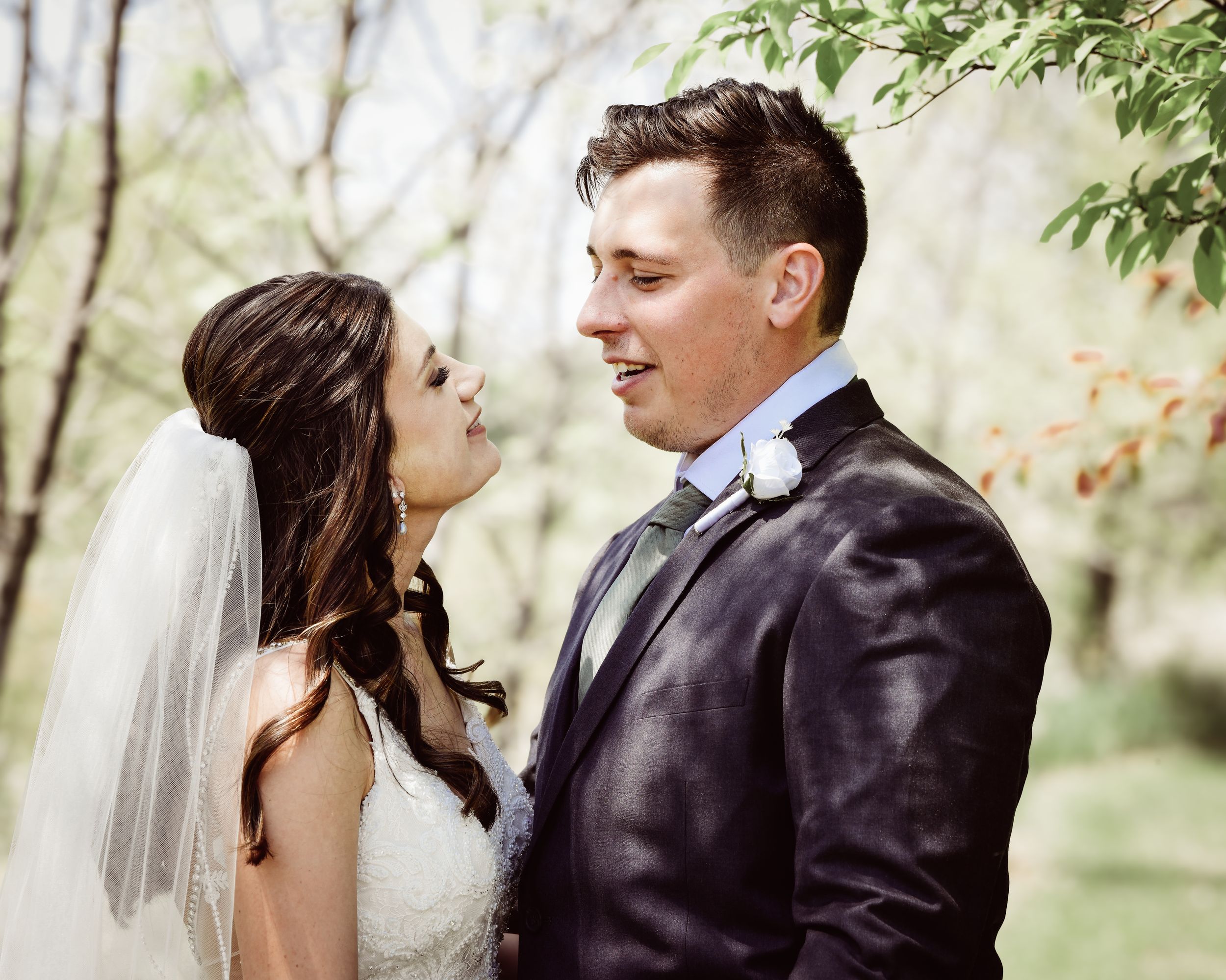 Romantic wedding sequence showing tender moments between newlyweds in a garden setting.