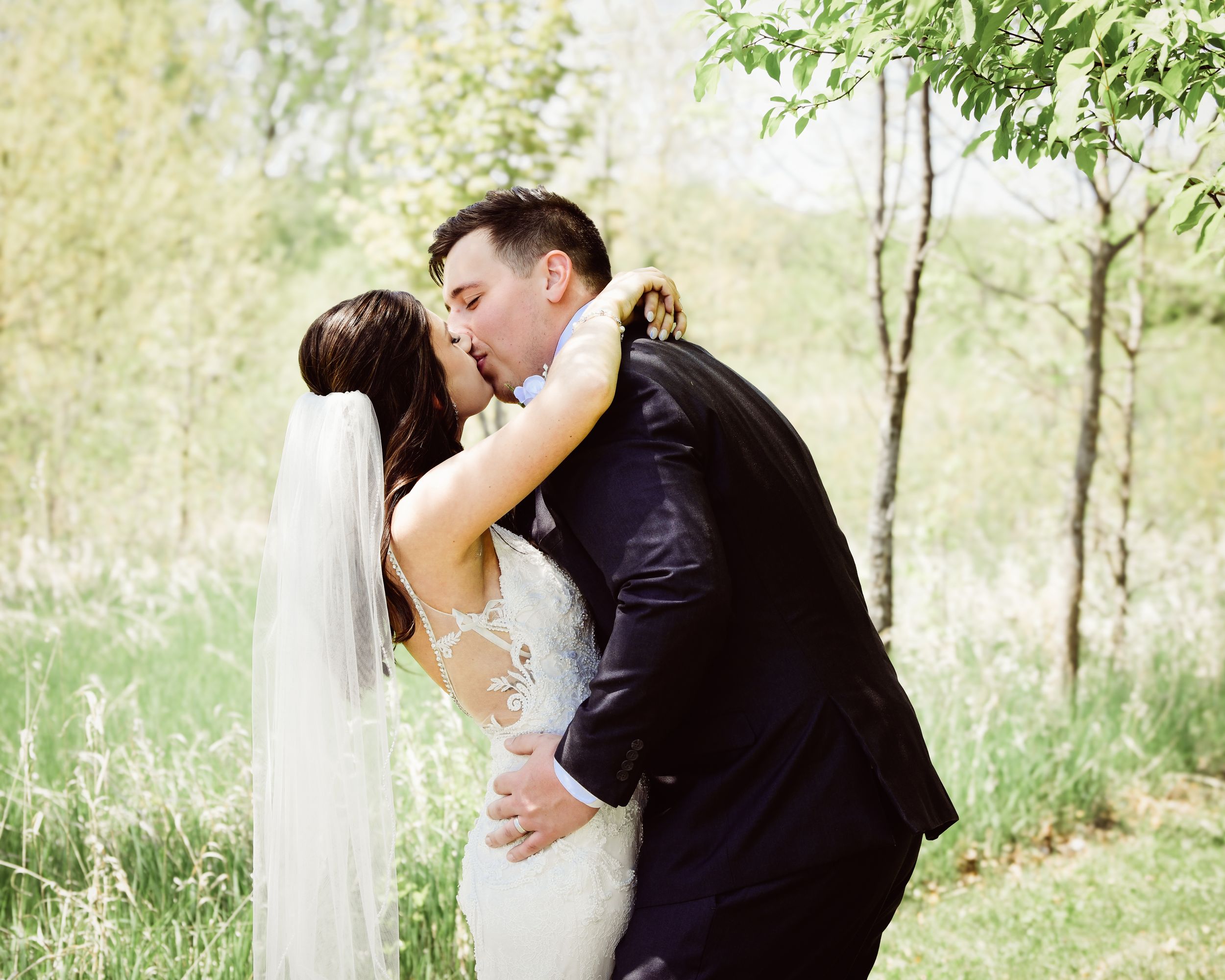 Series of intimate wedding photos capturing tender moments between newlyweds outdoors.