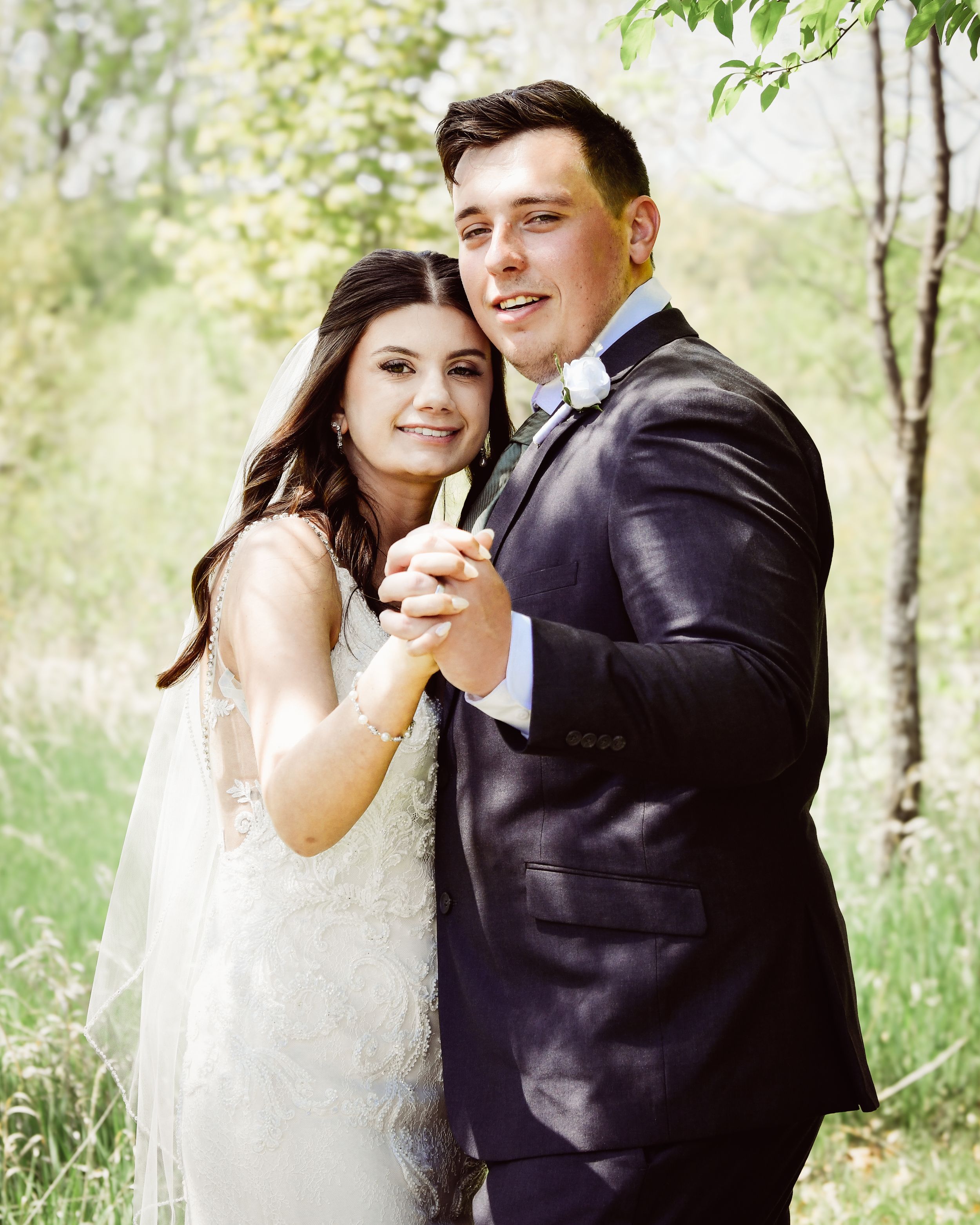 Candid wedding photo series capturing joyful moments between newlyweds in nature.