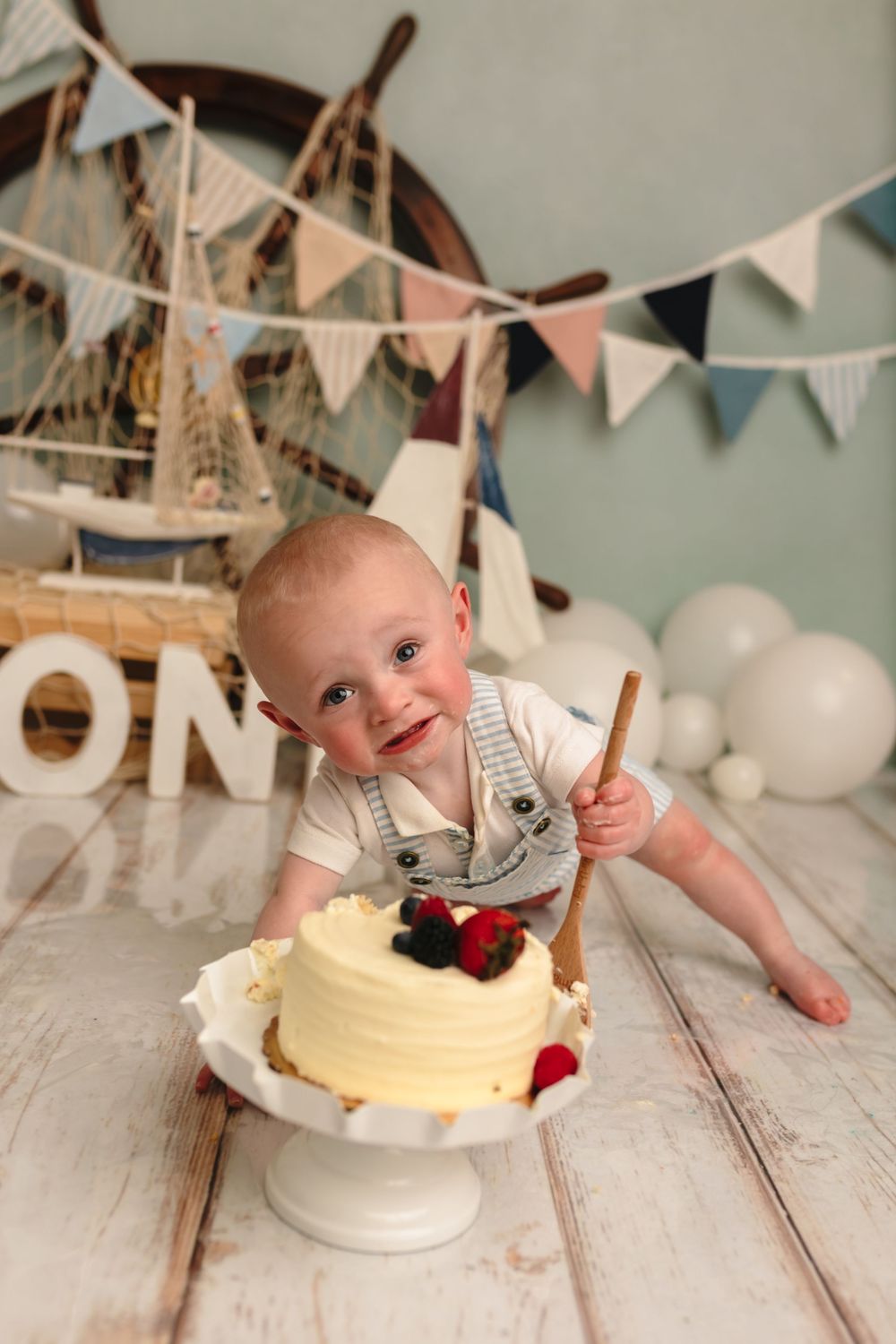 Charlottesville baby photographer, nautical-themed first birthday cake smash session for baby boy in Somerset Portraits studio.