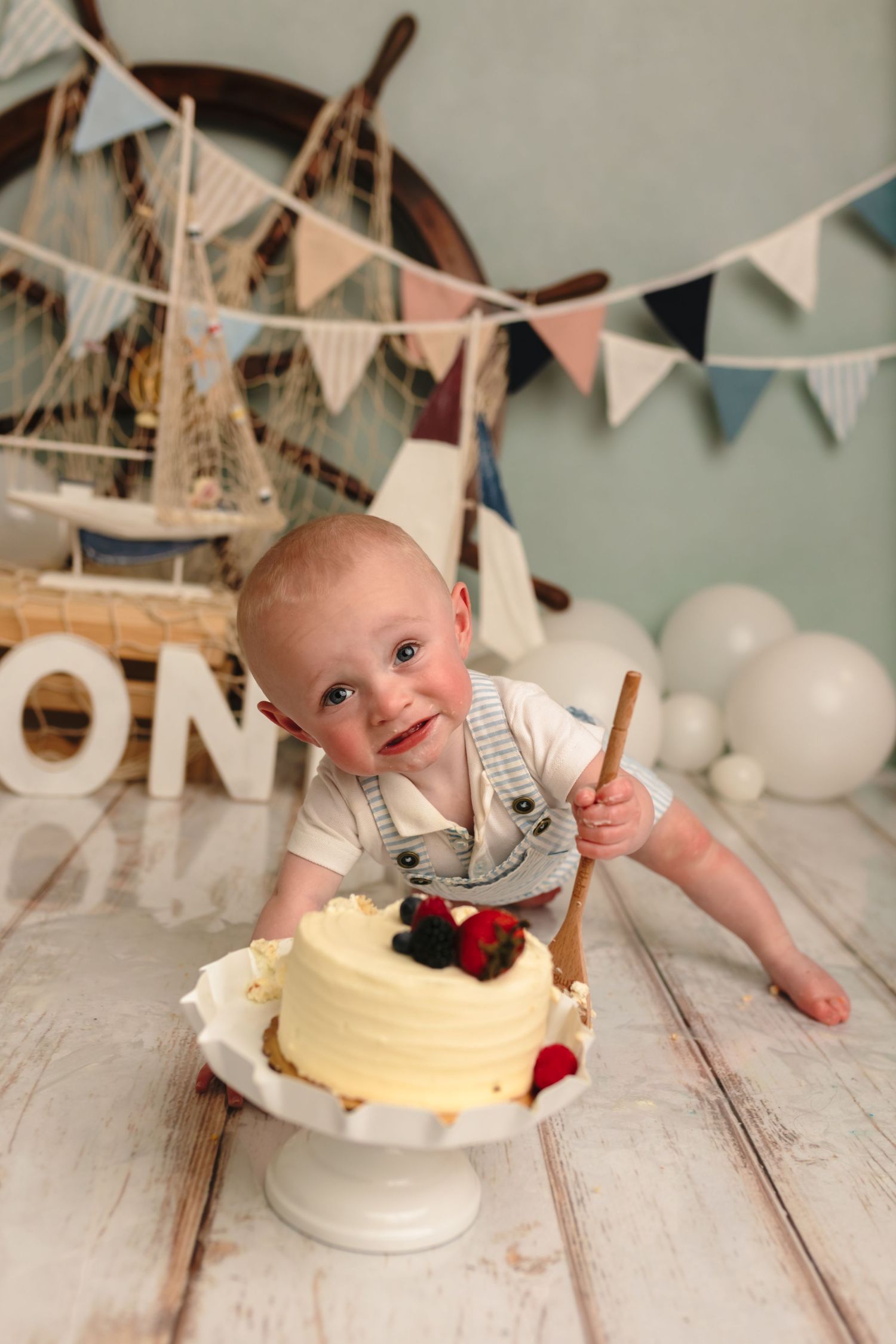 Charlottesville baby photographer, nautical-themed first birthday cake smash session for baby boy in Somerset Portraits studio.