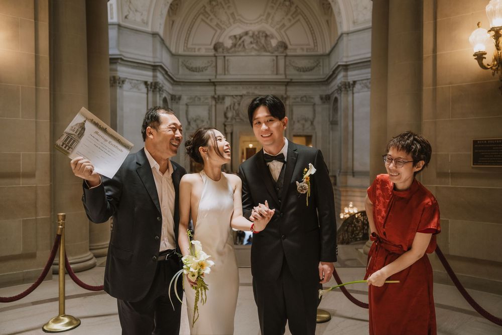 A series of candid wedding moments captured at a grand marble venue with elegant architectural details and interior lighting.