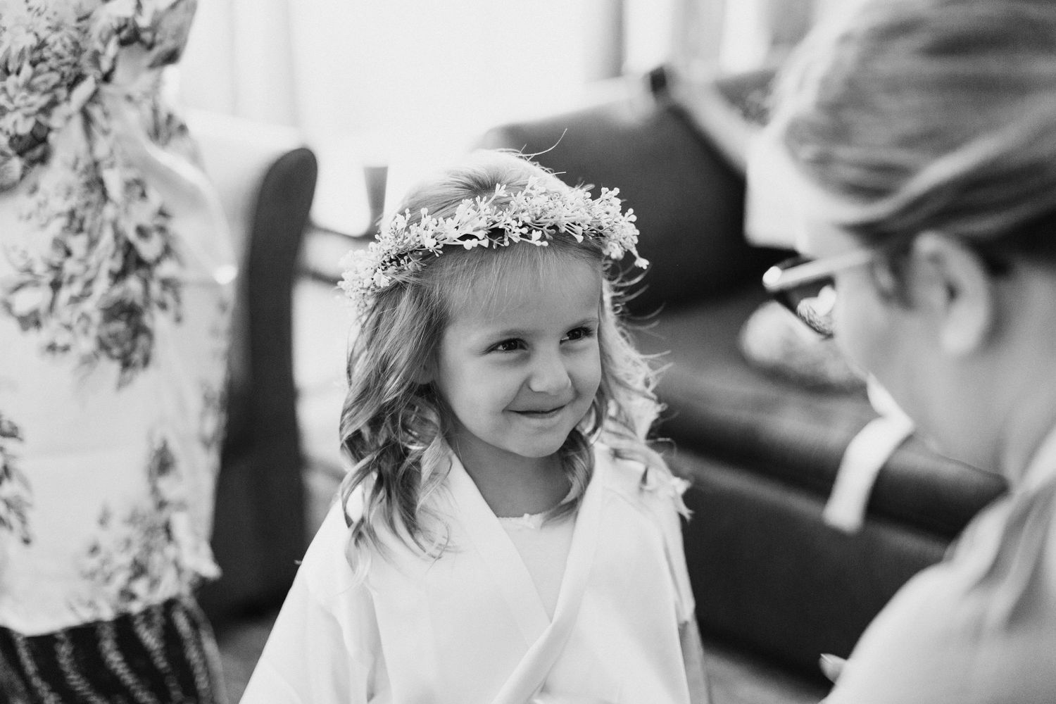 Black and white portrait series showing joyful candid moments and genuine expressions.