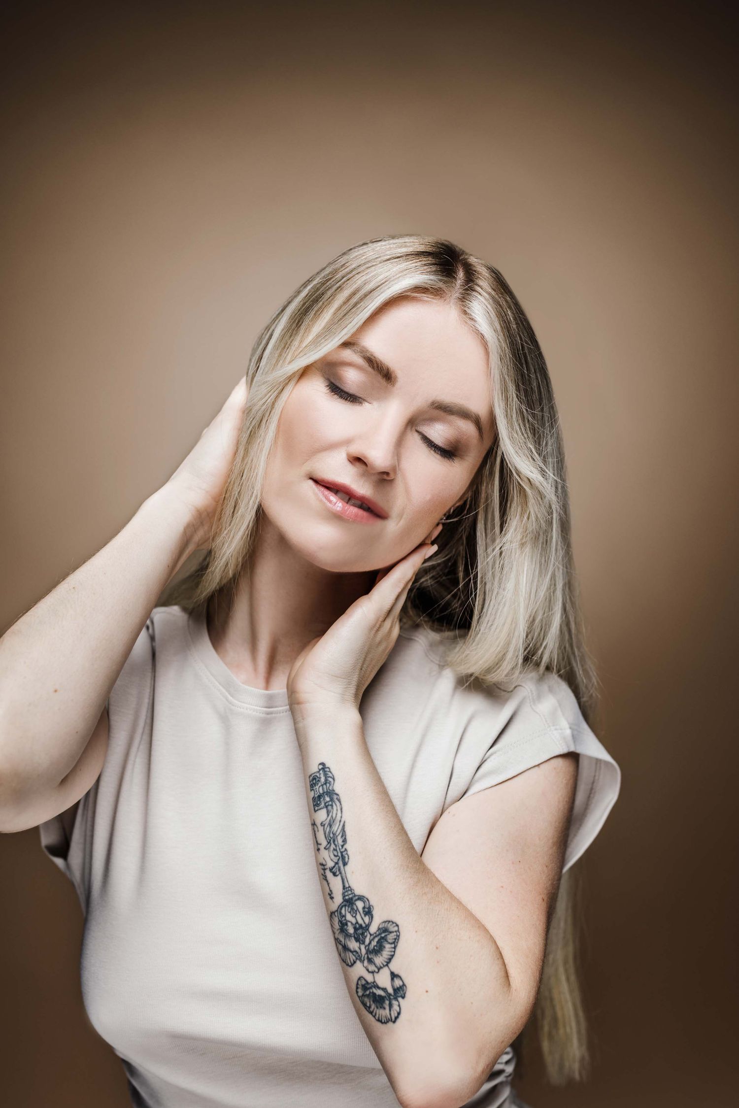 Elegant portrait sequence featuring soft lighting and natural poses against warm brown background.