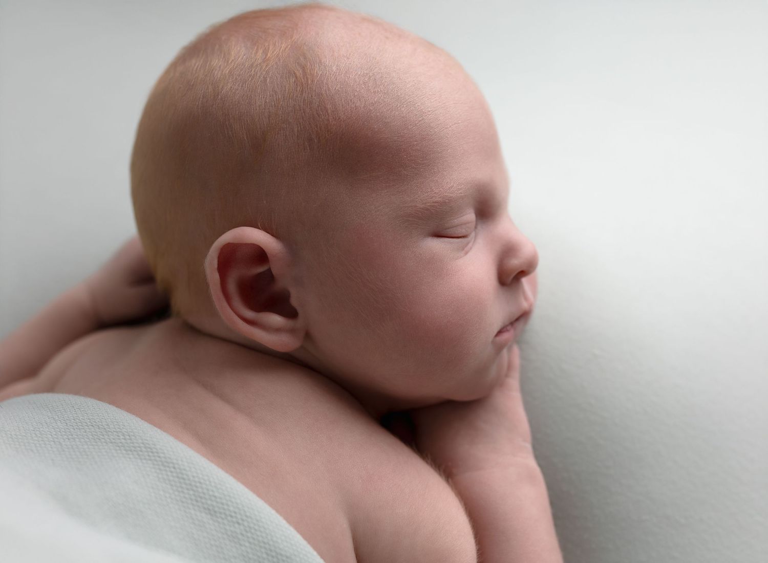 side profile of newborn baby asleep during Glasgow baby photoshoot