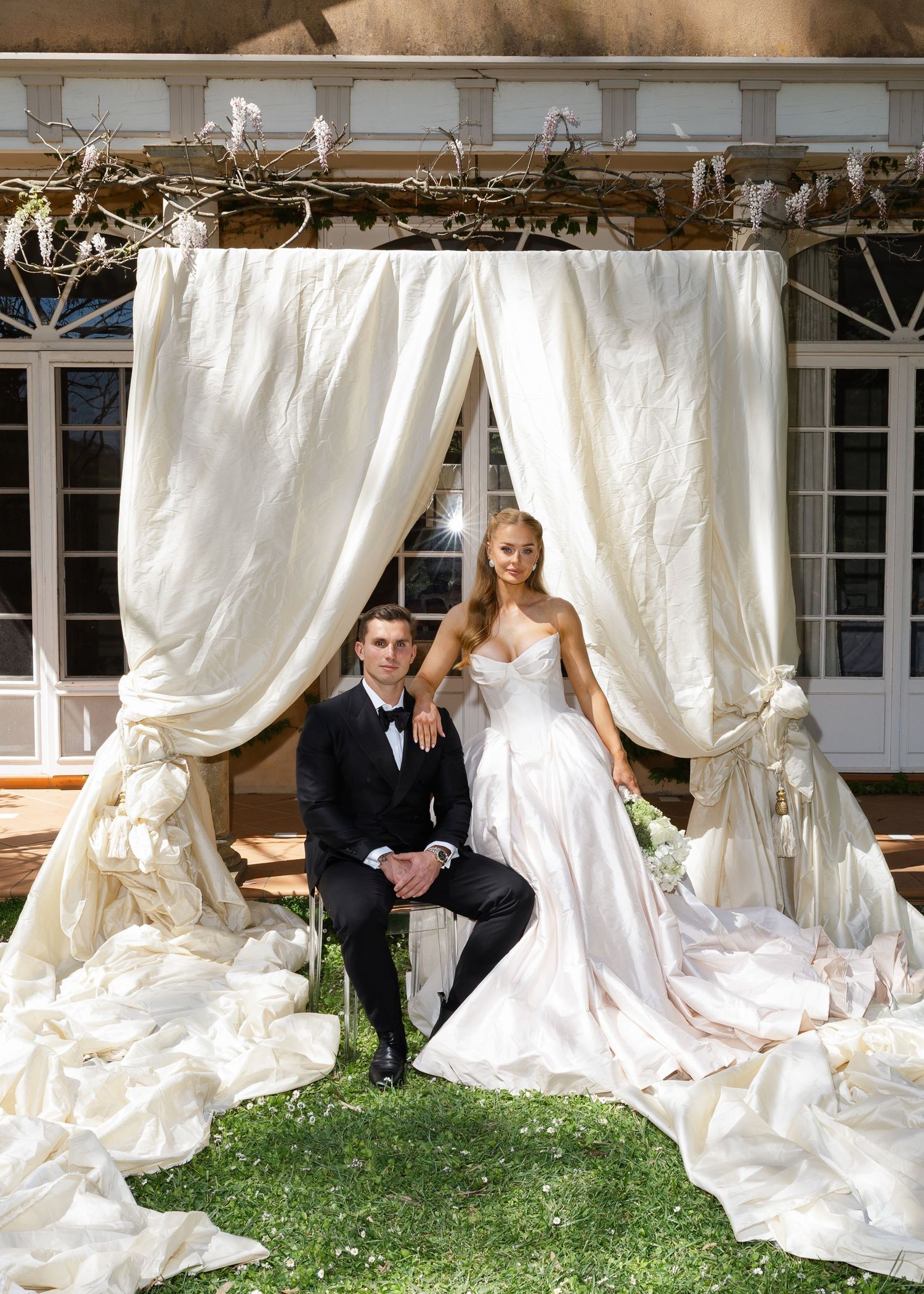 Artistic wedding photo sequence showing couple playfully hiding behind flowing white draping in an outdoor garden setting at Al Ru Farm.