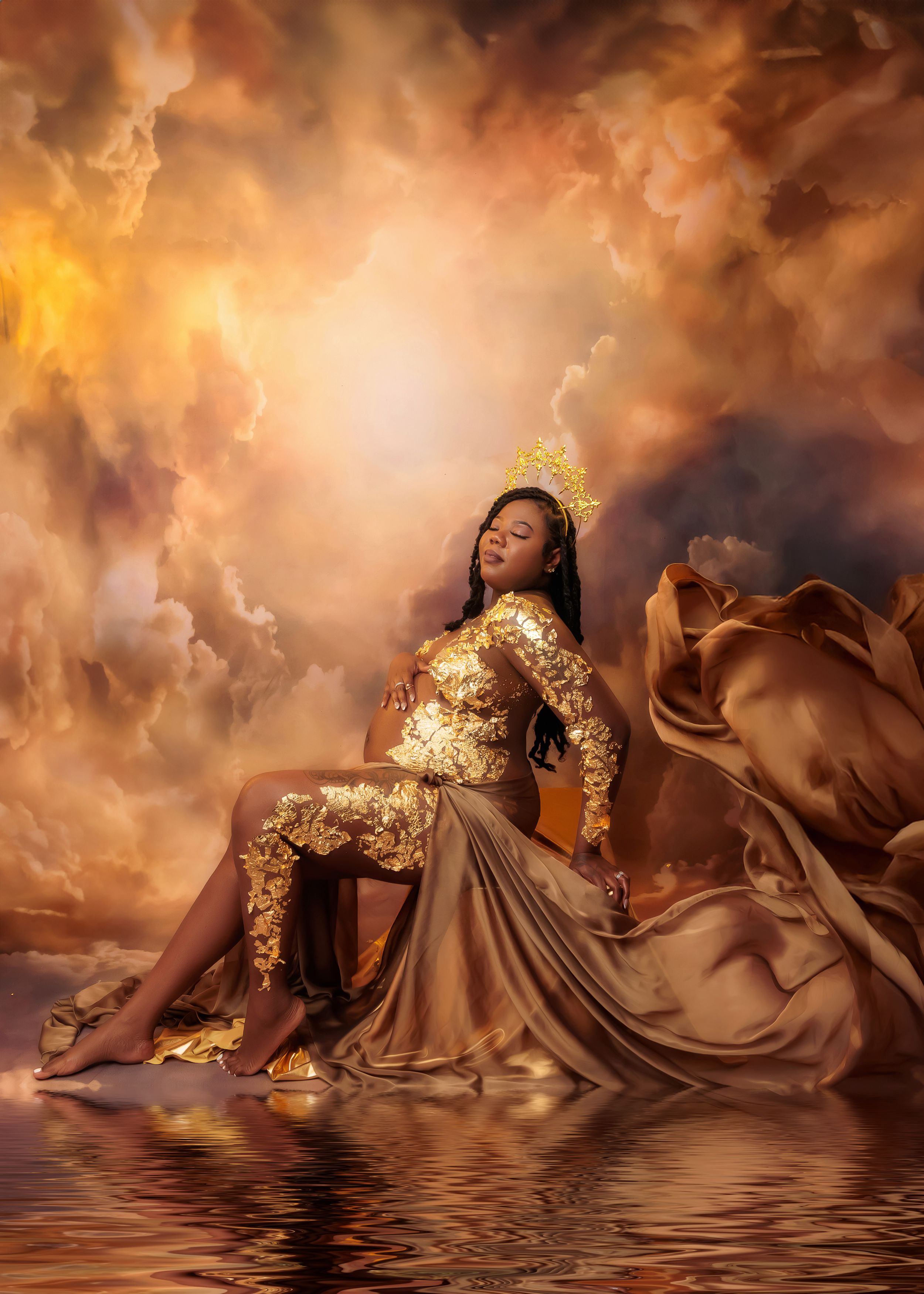 Pregnant woman in gold sequin outfit poses regally against a dramatic golden cloudy sky maternity backdrop.