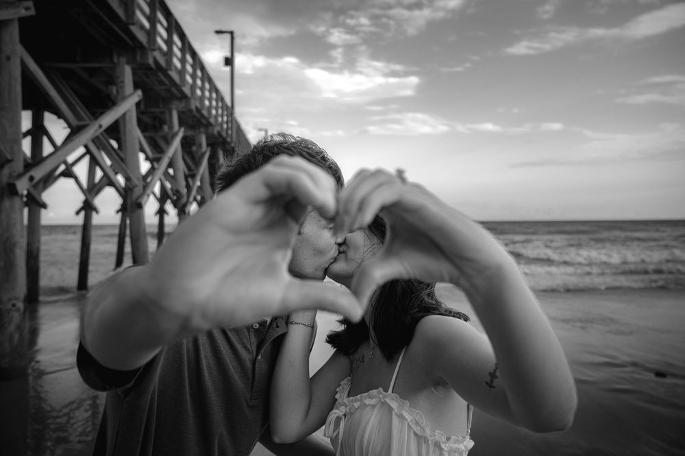 A series of black and white beach photographs showing silhouettes of people against dramatic ocean and pier backdrops.