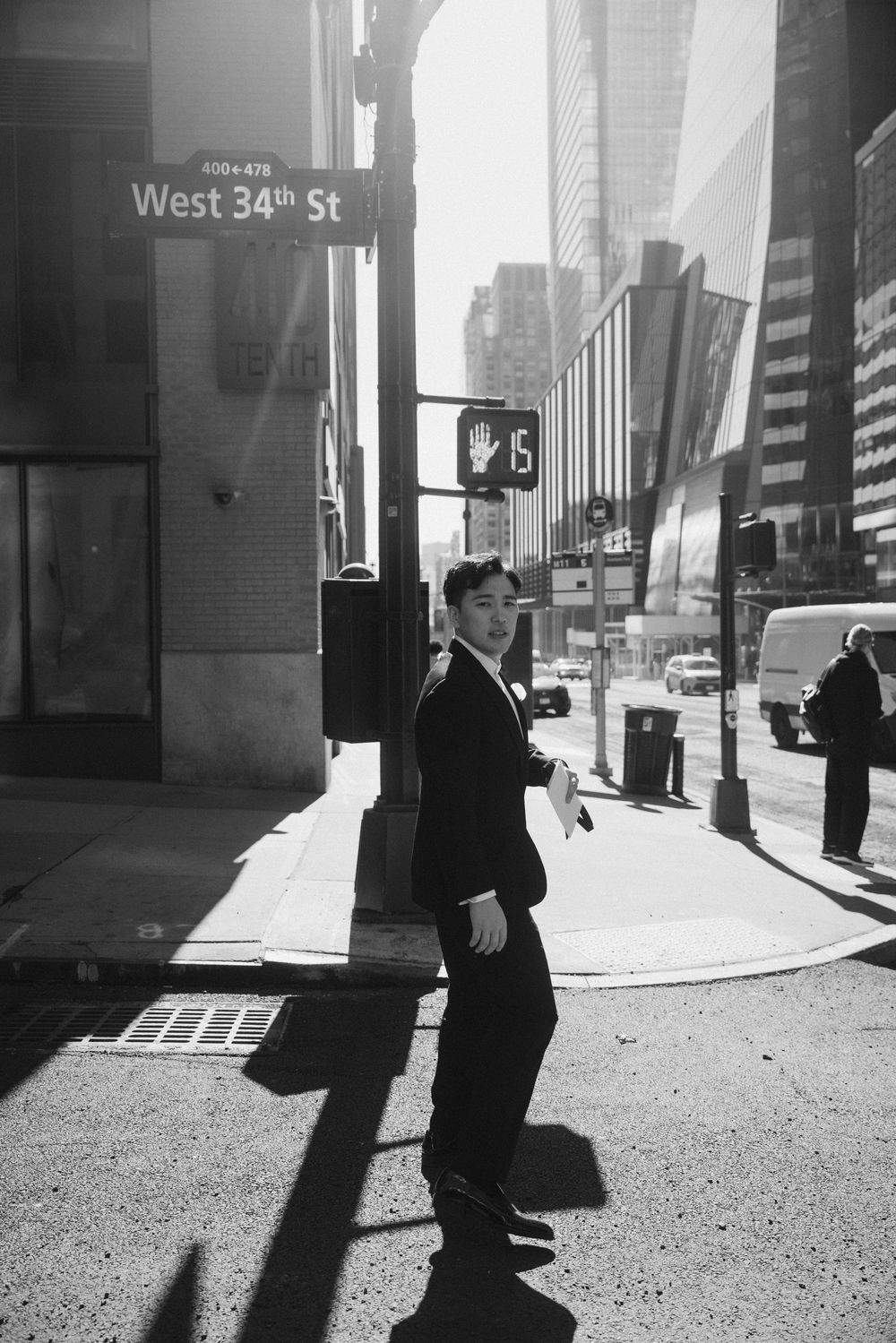 Street scene on West 34th Street in New York City with dramatic shadows.