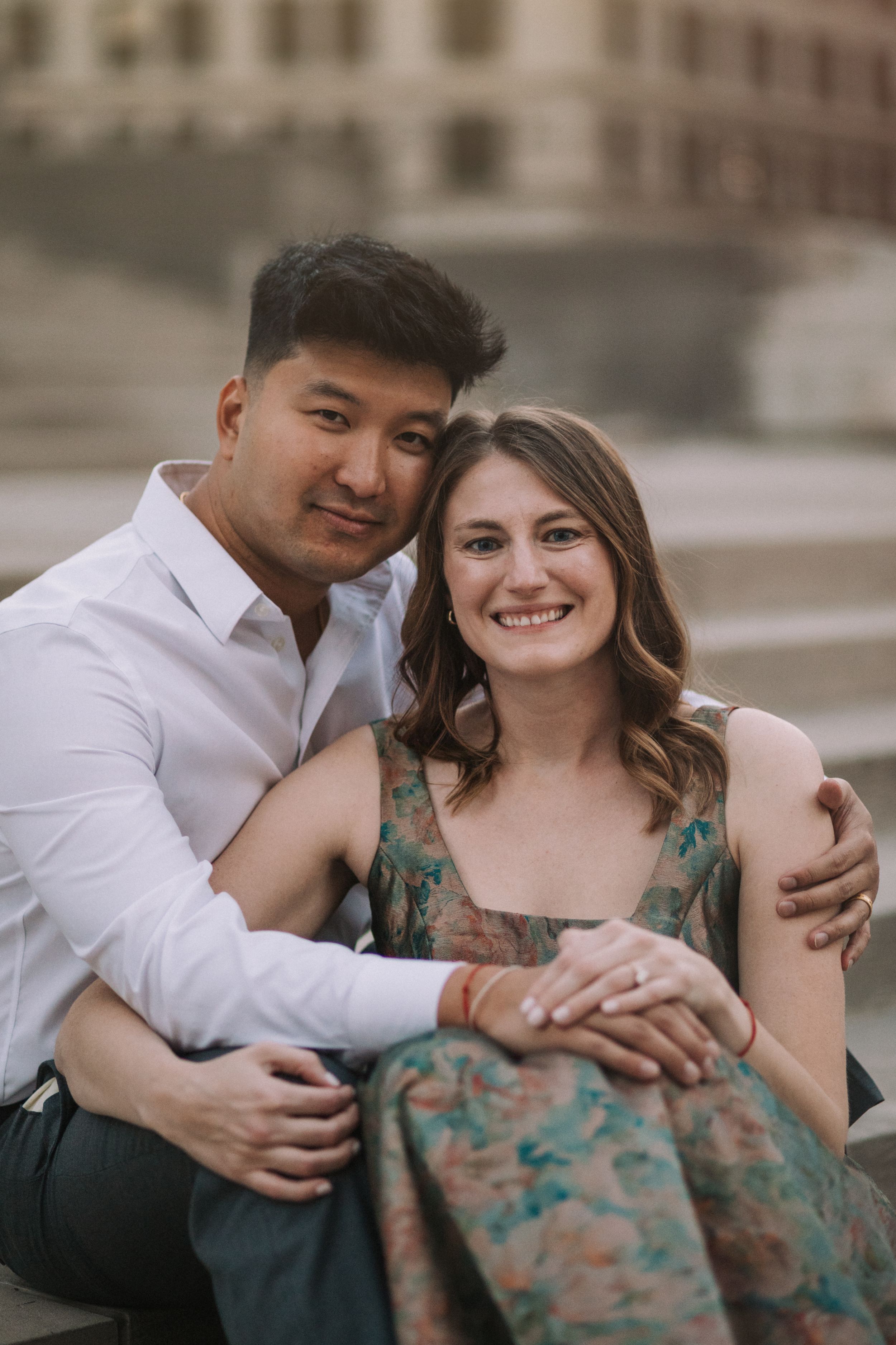 Candid moments of affection captured during urban couple's photography session.