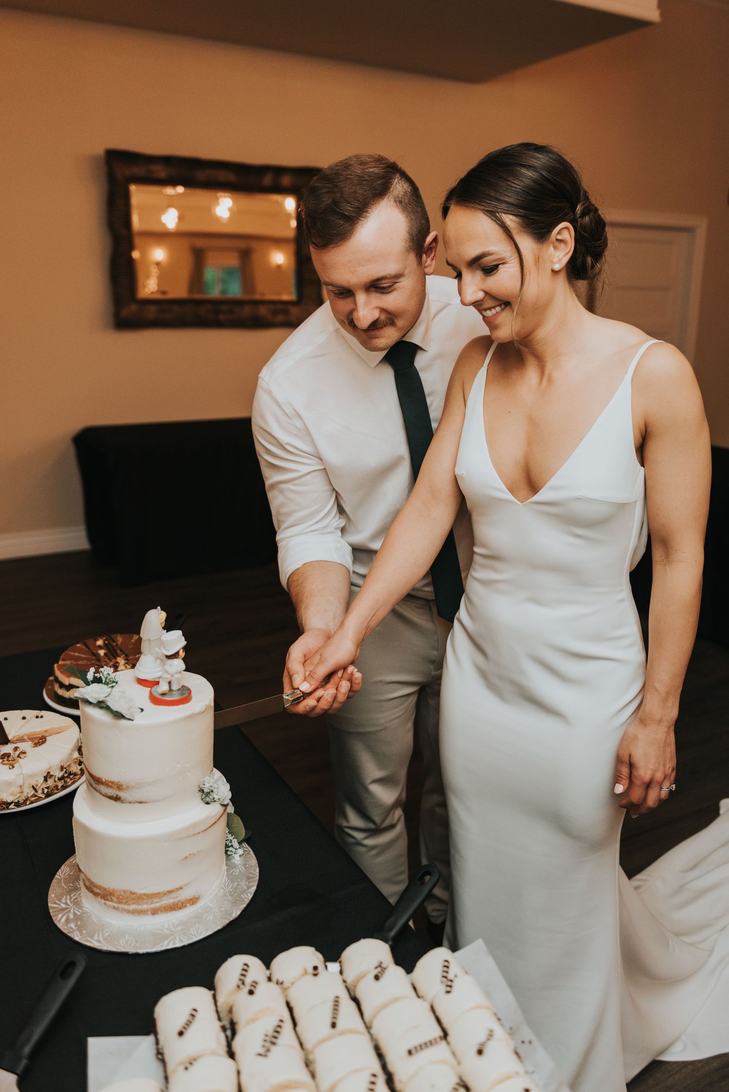 Series of candid moments showing a couple cutting their minimalist wedding cake at an intimate reception.
