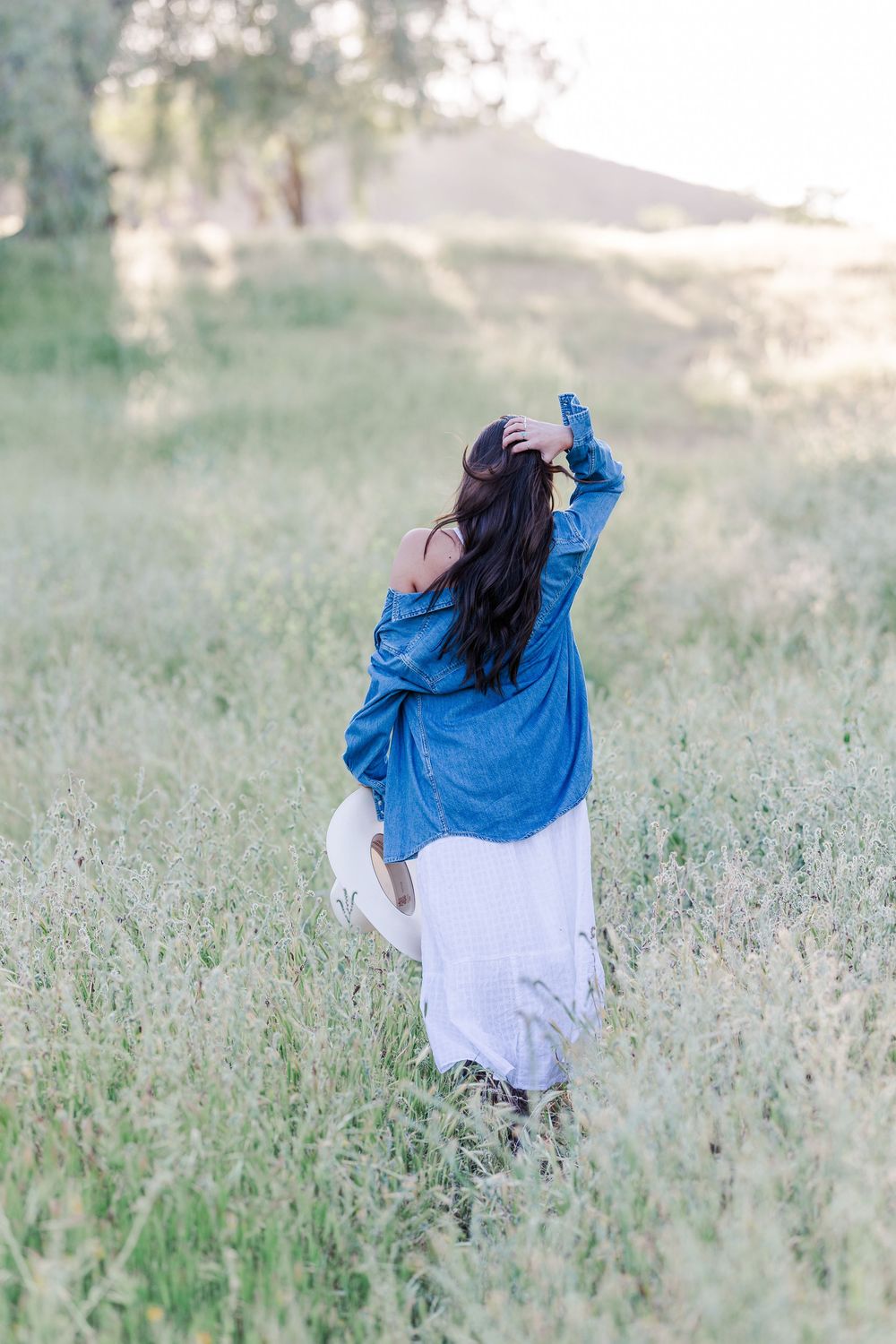 Outdoor senior photos in Simi Valley open field at golden hour