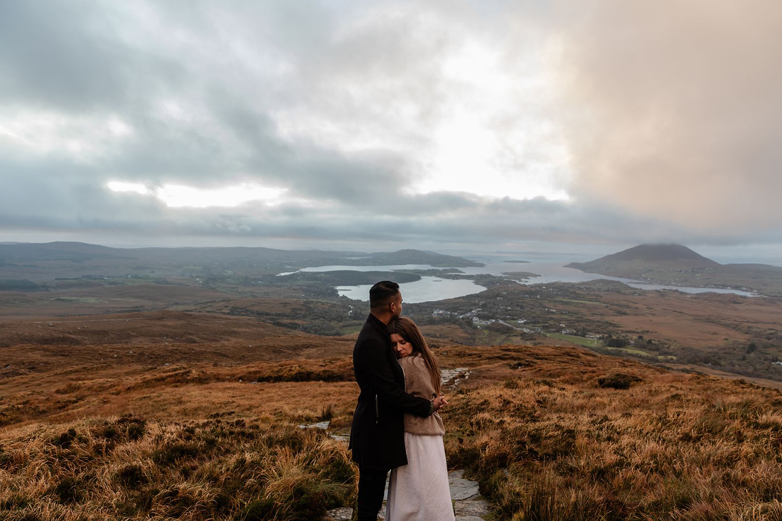 Elopement-style couple session on
Diamond Hill with sweeping mountain views in Connemara