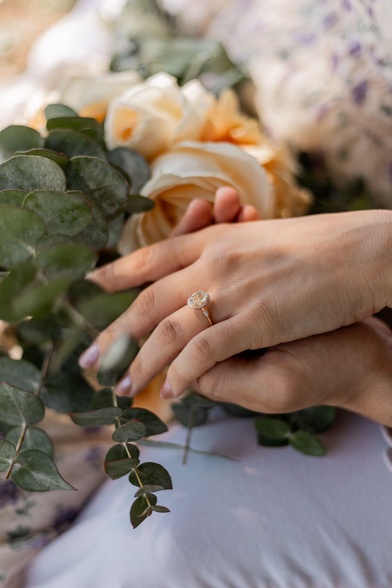Close-up series of hands holding a vibrant bridal bouquet with coral, pink, and purple flowers against a white background.