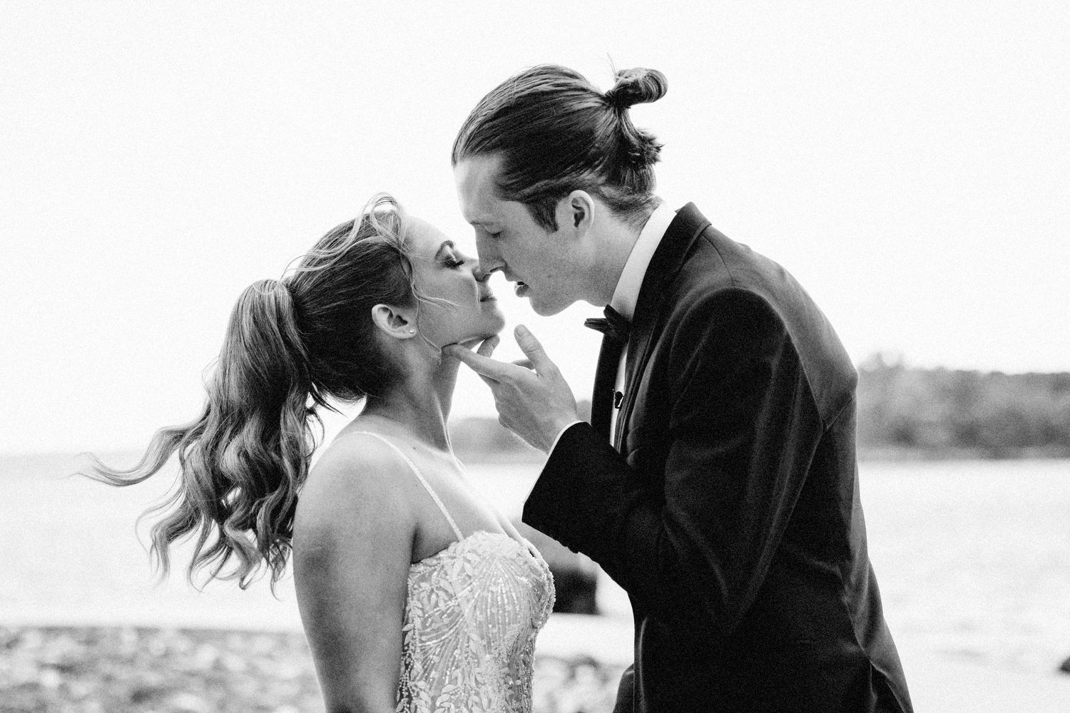 Black and white romantic wedding portrait series showing intimate moments between newlyweds.