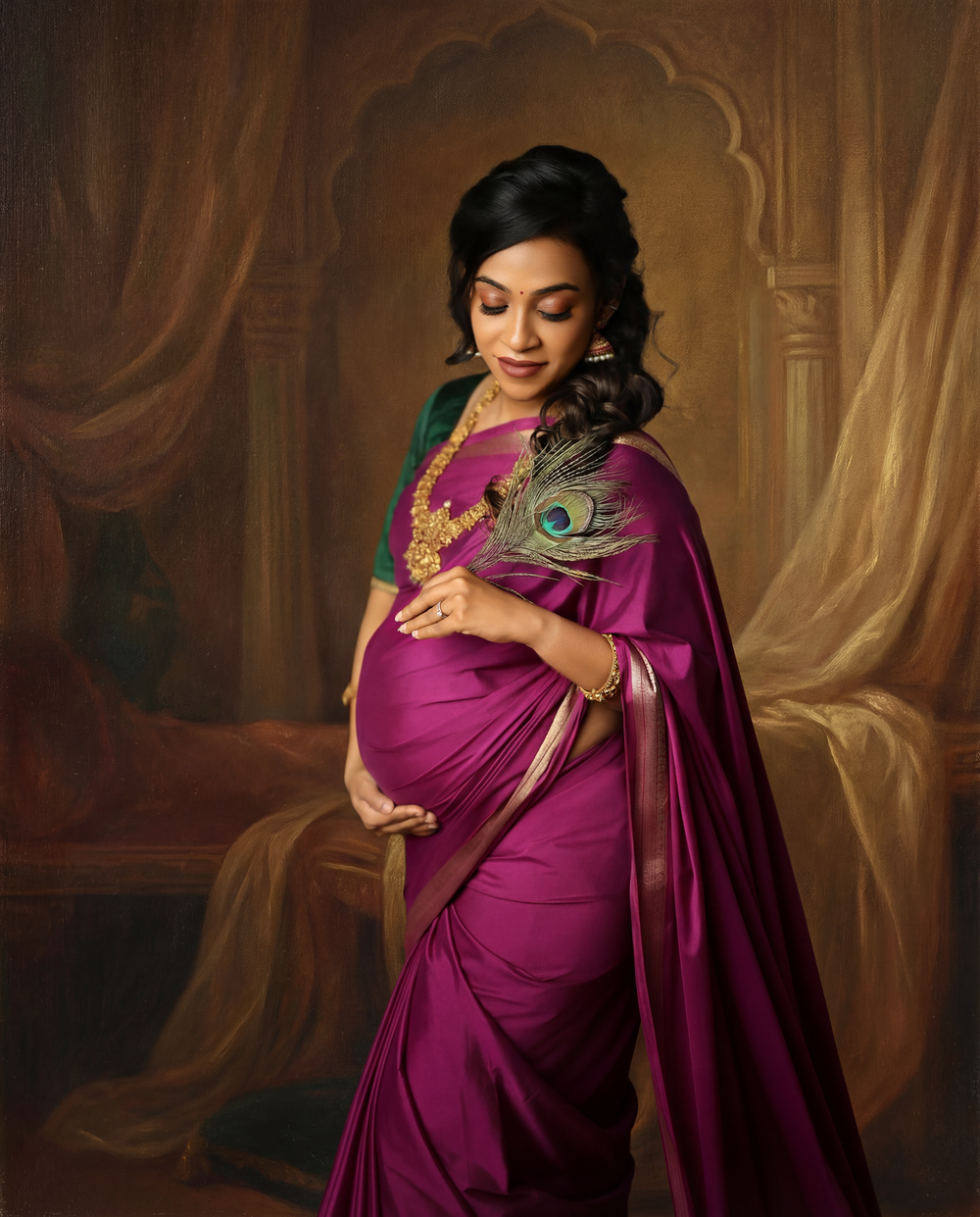 A woman in a flowing magenta dress poses elegantly with a peacock feather in a studio setting.
