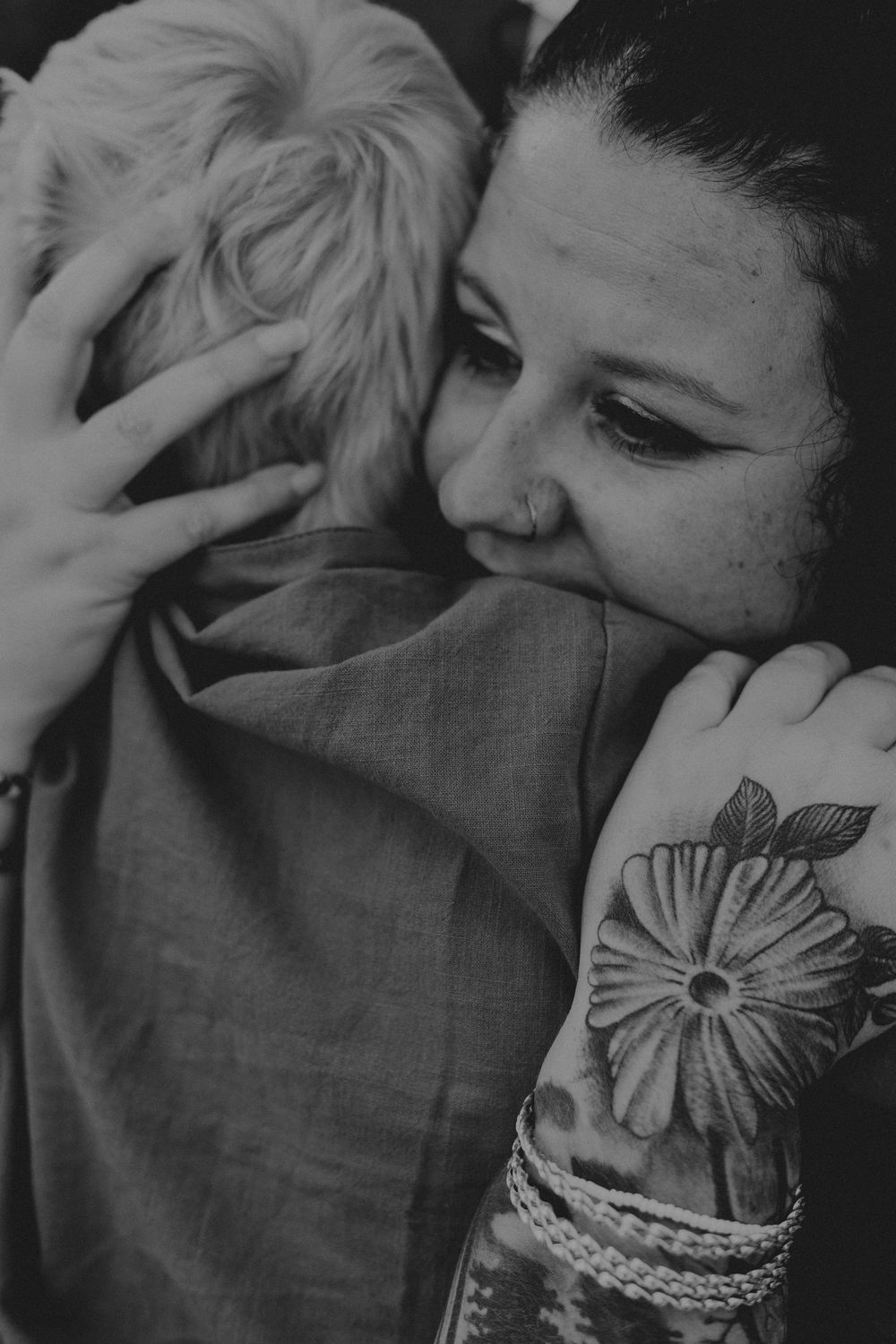 A series of black and white photos showing intimate moments between a couple in close embrace.