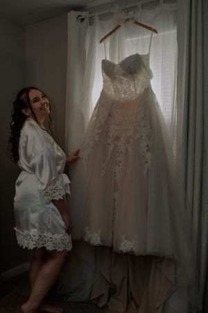 Series of photos showing a white lace wedding dress hanging by a window in morning light.