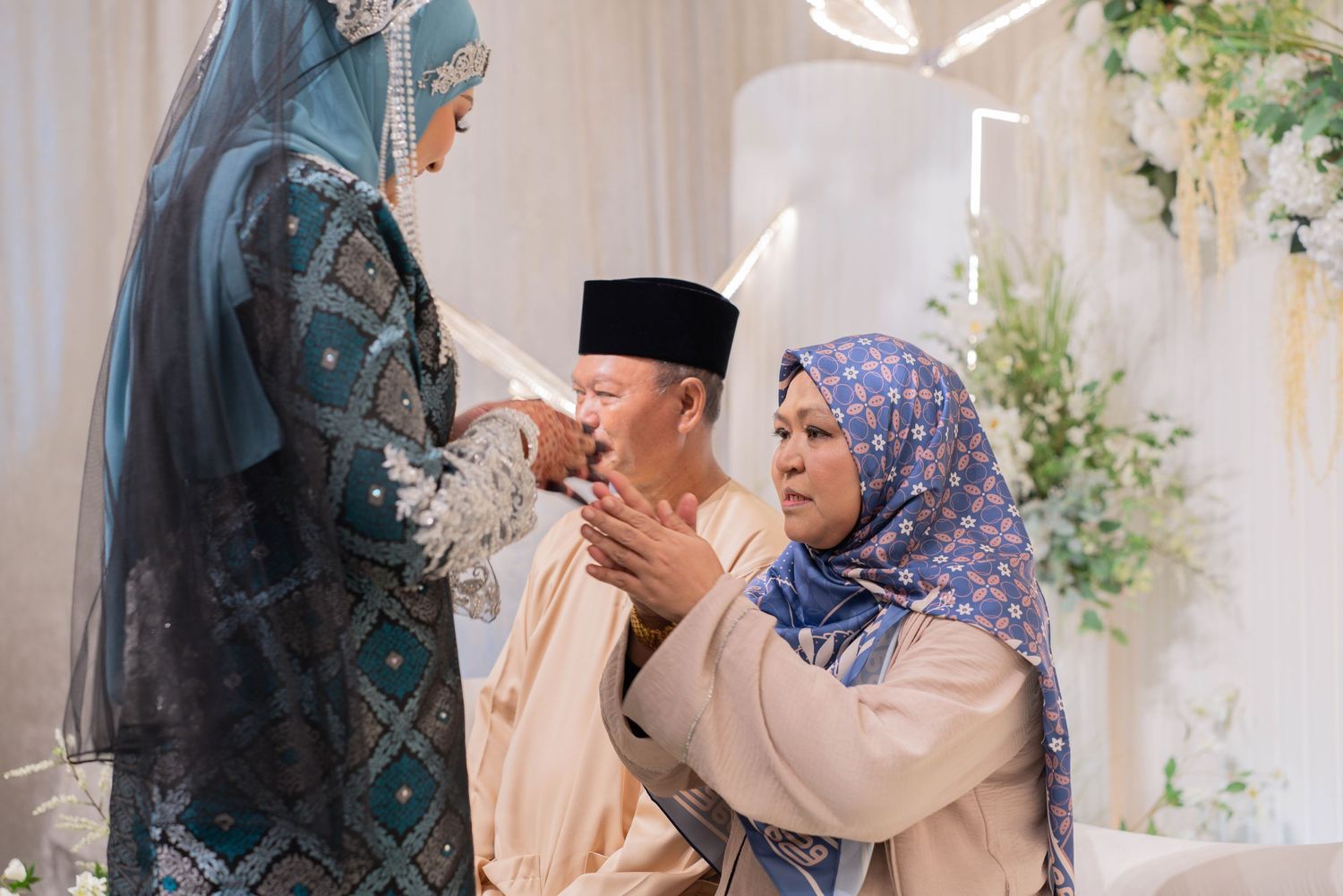 A traditional greeting ceremony taking place during a Muslim celebration with elegant decor.