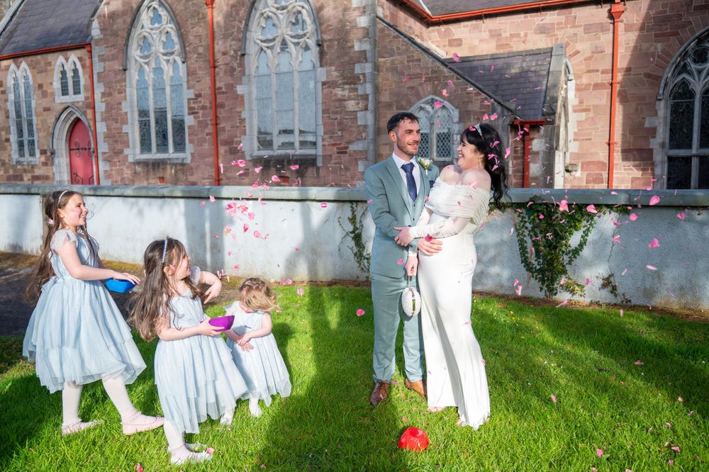 Bride and Groom posing with their daughters in Tralee County Kerry