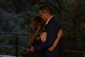 Romantic evening wedding portraits captured against a natural backdrop.
