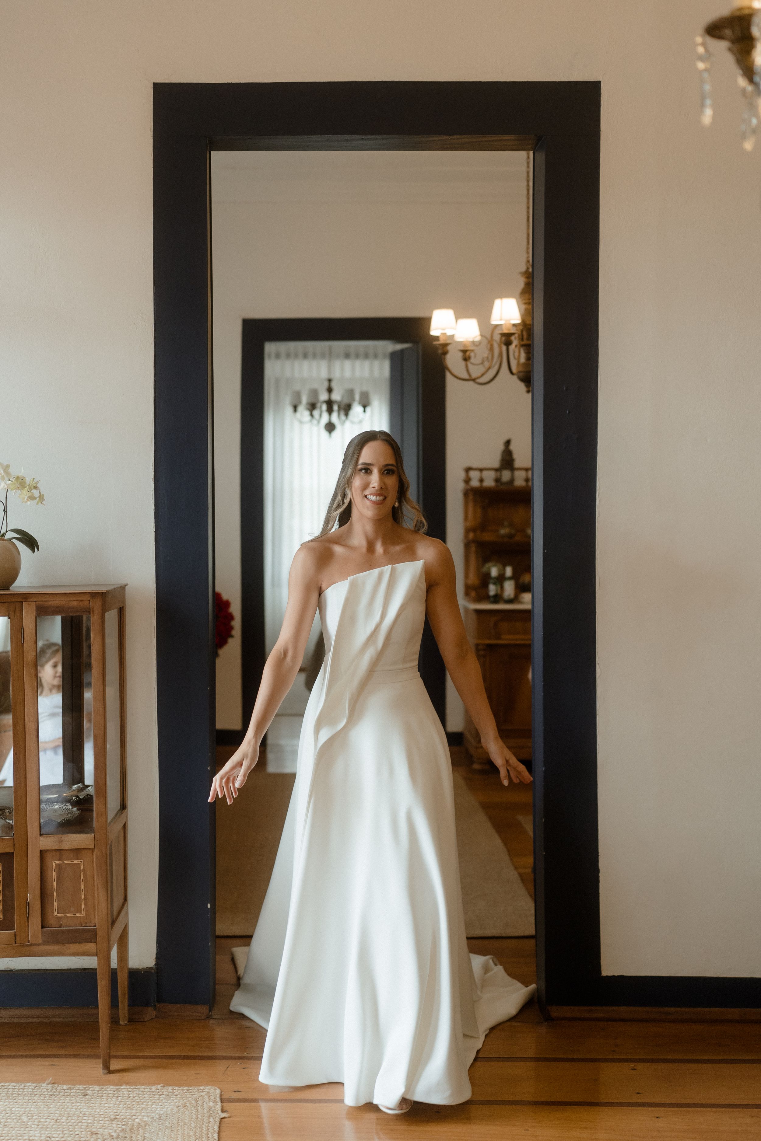 Elegant white wedding dress swishes and flows in a sequence of movement shots against a minimalist interior.