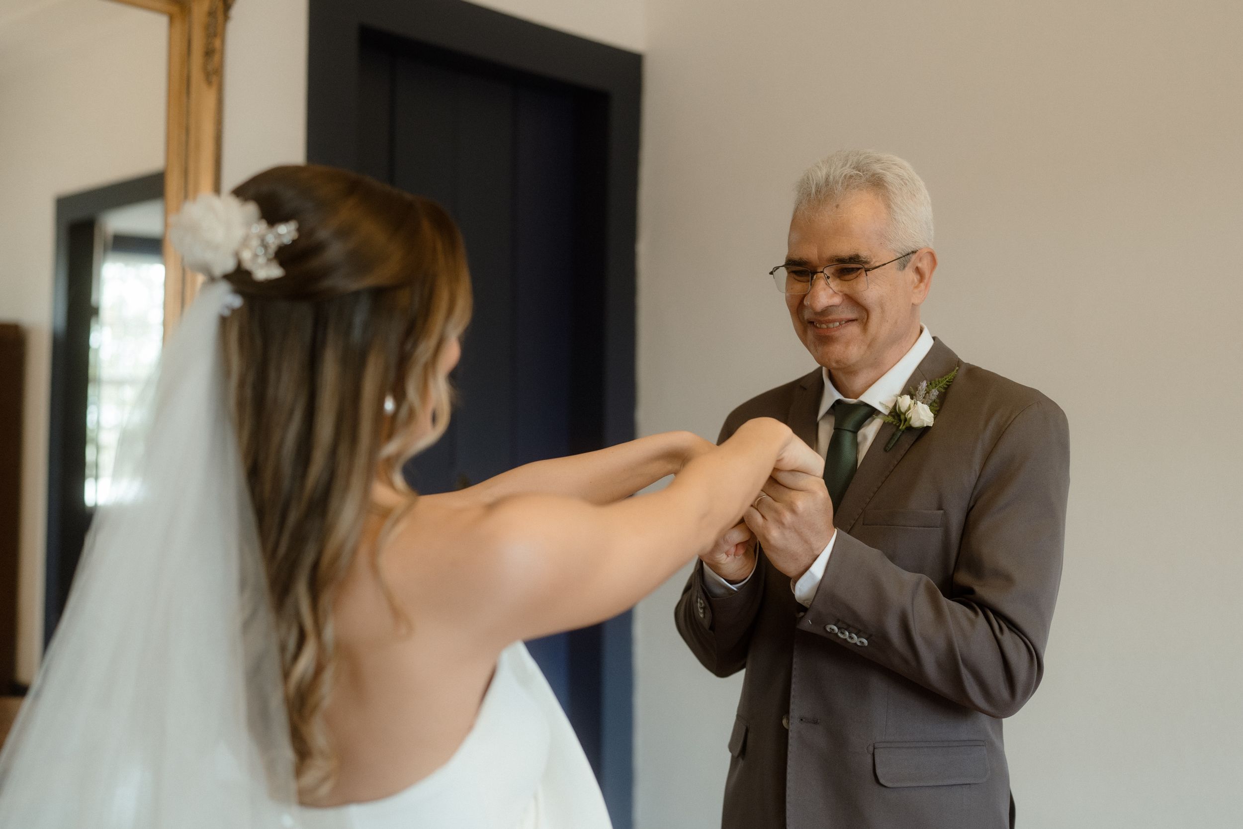 Series of emotional first look moments in an intimate indoor setting.