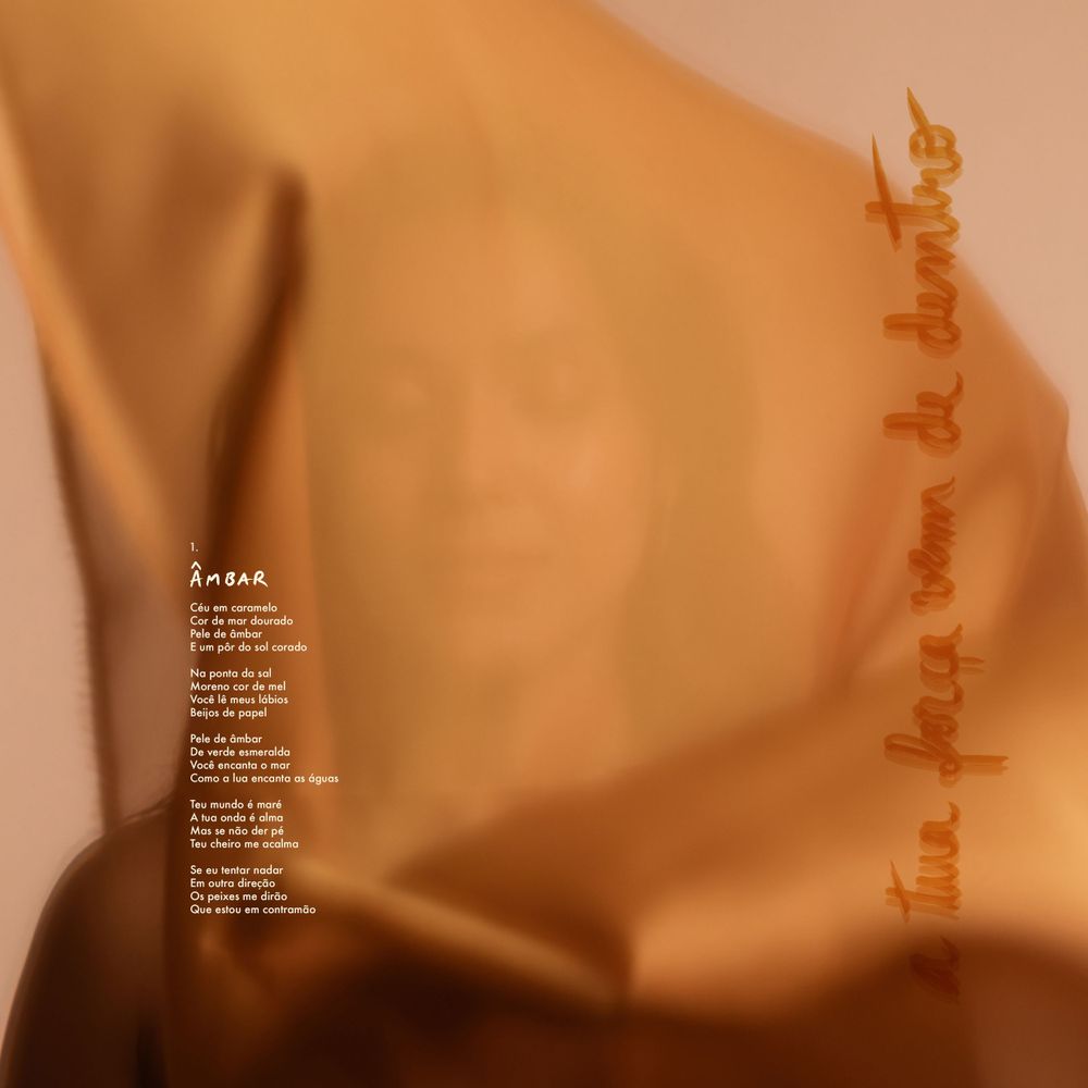 Soft brown fabric creates shadows and gentle folds with text overlay on a warm neutral background.