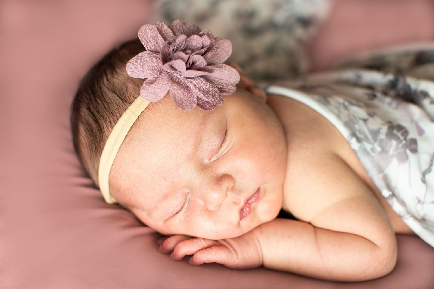 sleeping newborn baby purple flower