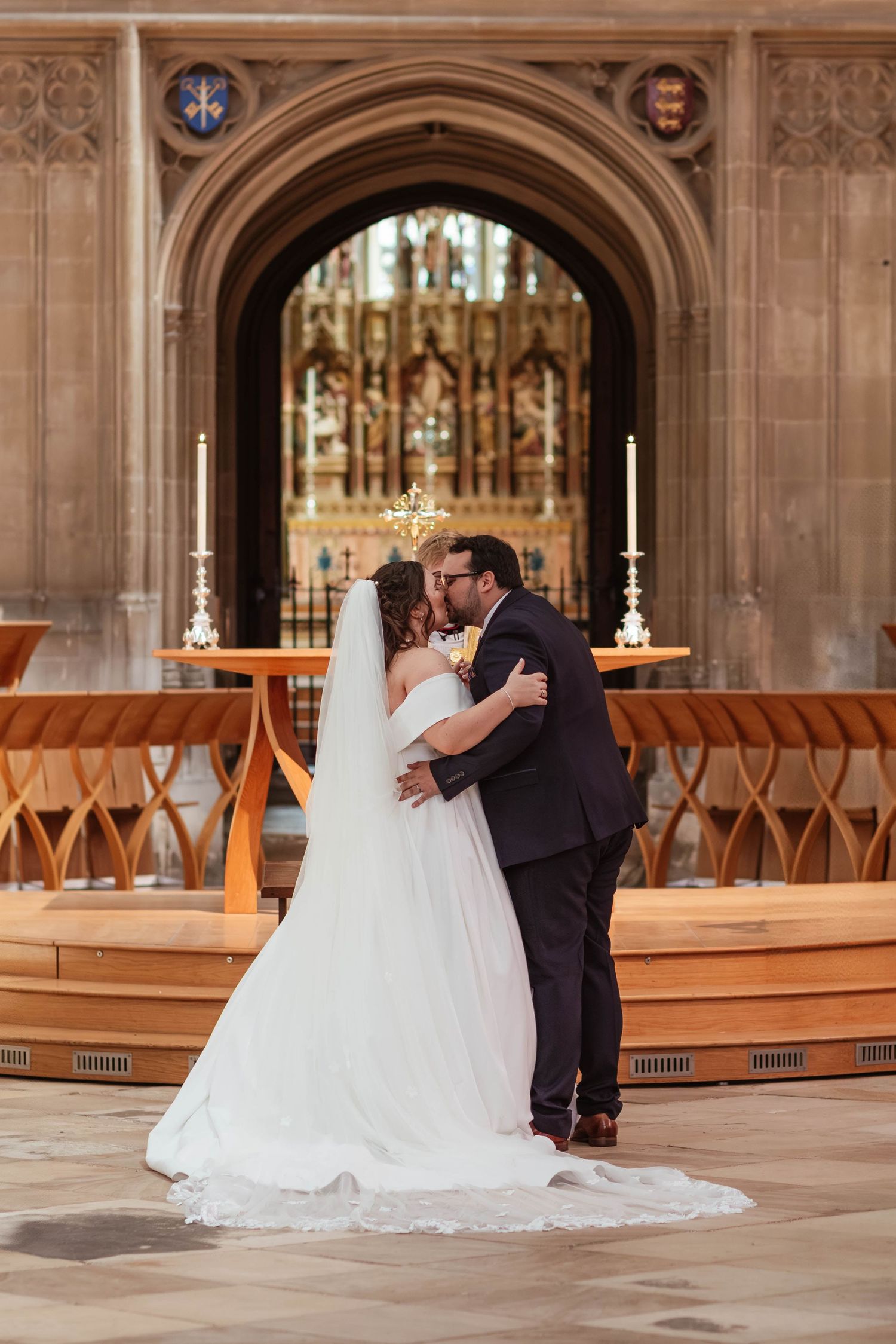 Gloucester Cathedral wedding photographer Gloucestershire Cheltenham first kiss for bride and groom in the nave