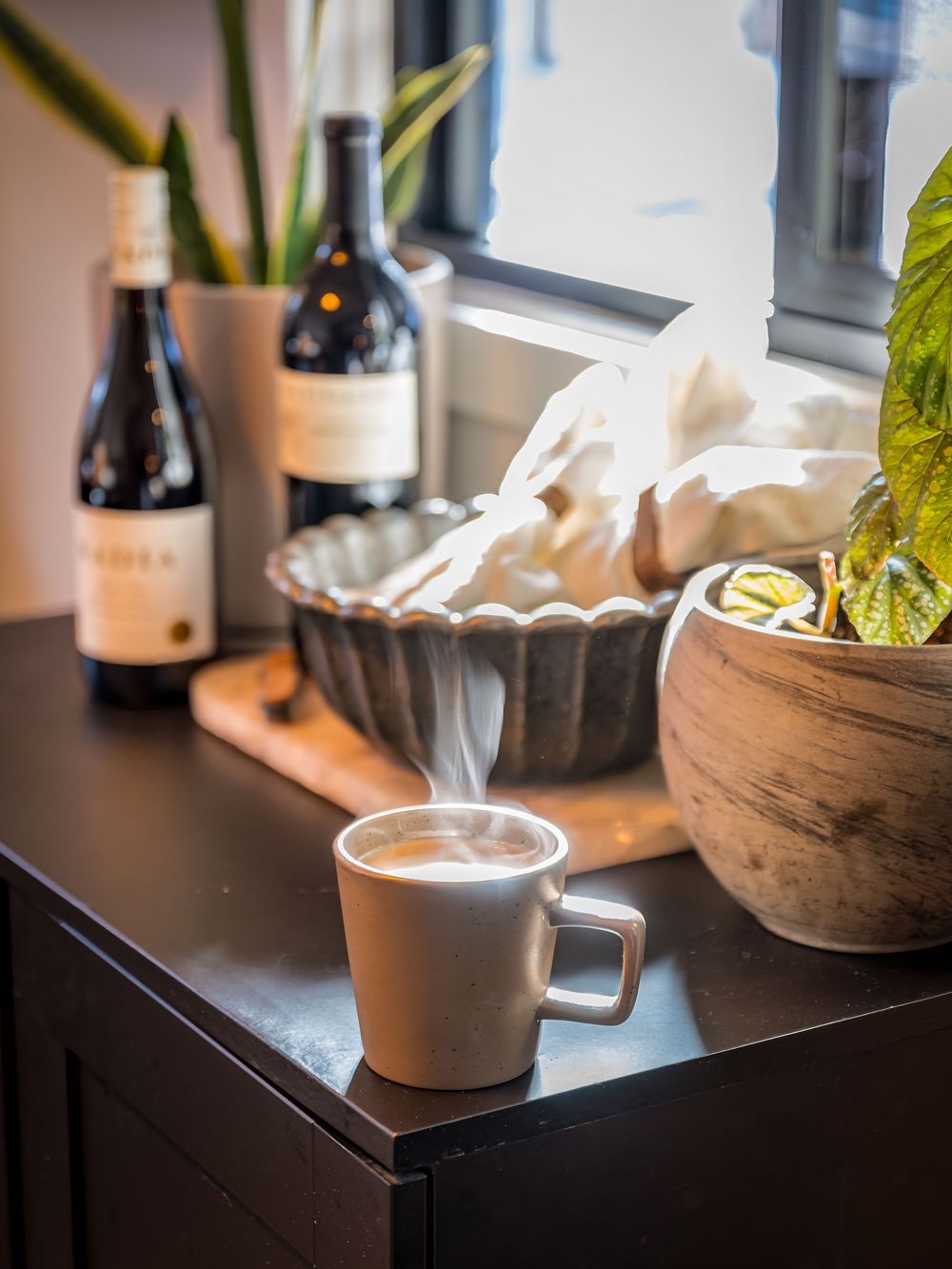 Detailed shot of a steaming cup of coffee in the kitchen by Denver Hospitality, Travel & Tourism photographer Captain Colorado Photography.