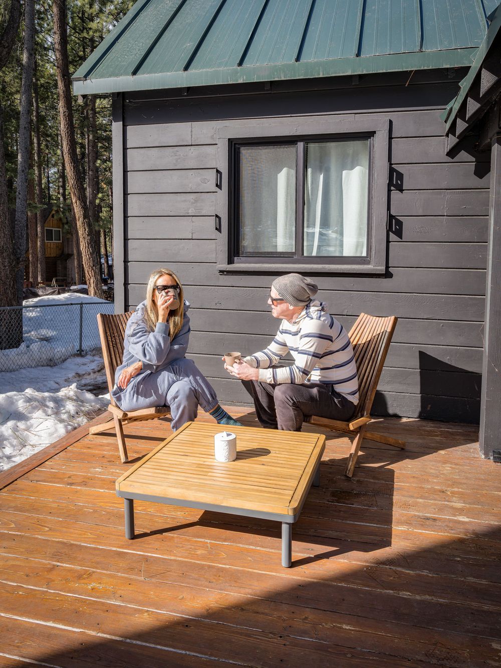 Couple enjoying the sun with coffee on the patio by Denver Hospitality, Travel & Tourism photographer Captain Colorado Photography.