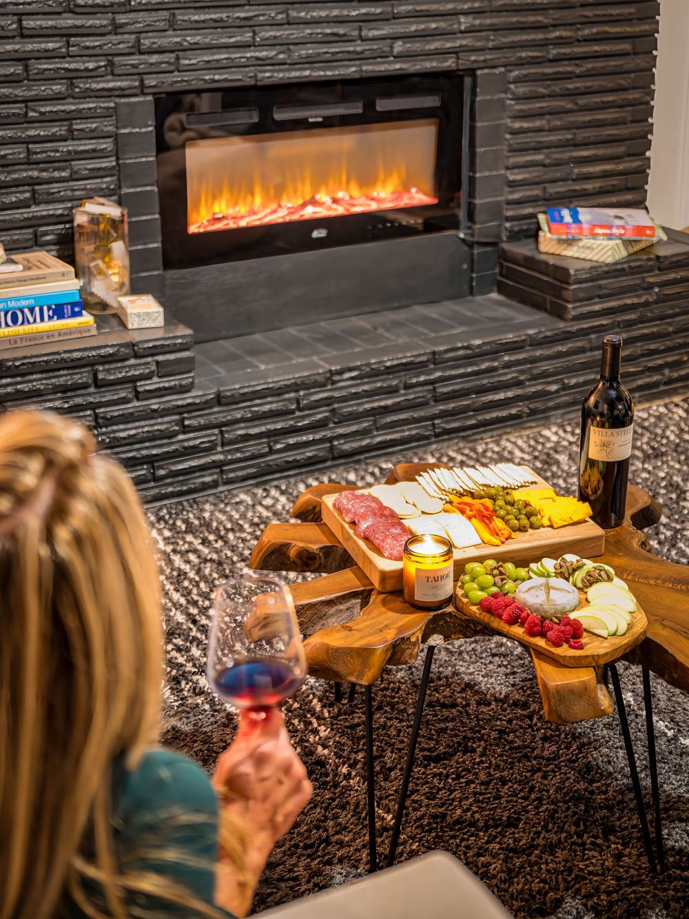 Woman enjoying wine and a charcuterie board by Denver Hospitality, Travel & Tourism photographer Captain Colorado Photography.