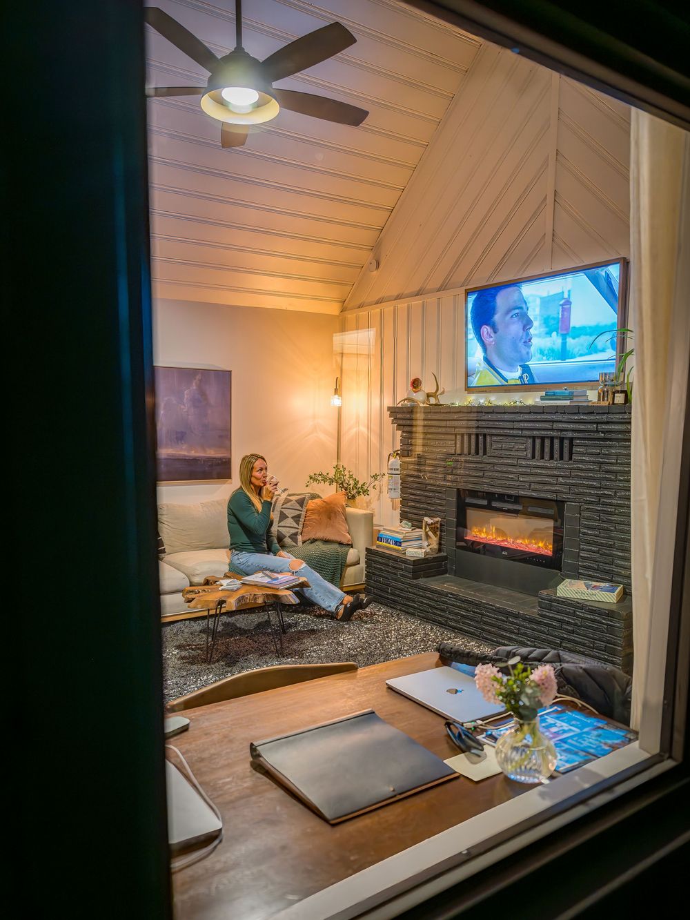 Woman enjoying a glass of wine in the living room by Denver Hospitality, Travel & Tourism photographer Captain Colorado Photography.