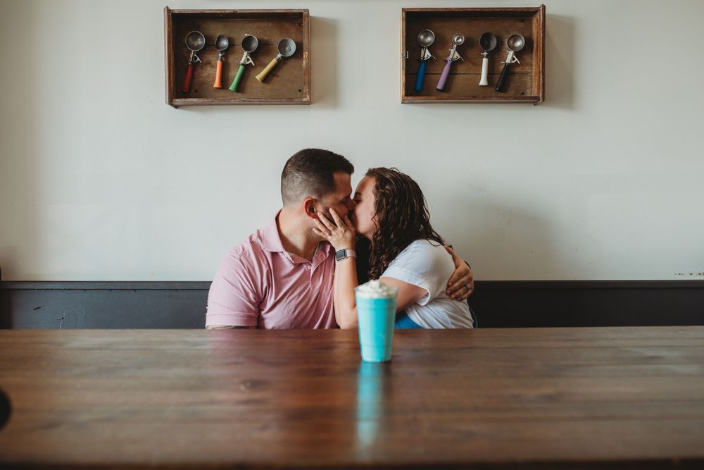A creative sequence of photos showing a blue cup being moved across a wooden table surface.