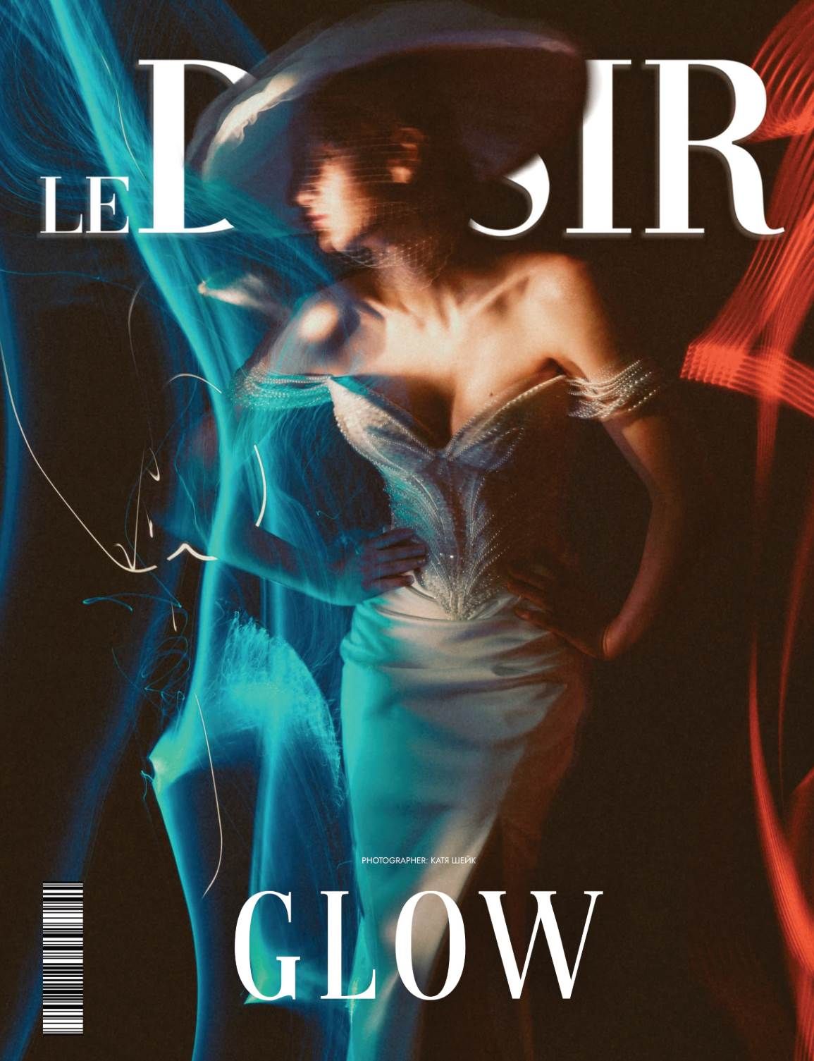 Le Desir magazine cover featuring a glowing model in white dress with vibrant blue and red light streaks, titled GLOW.