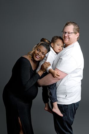 A series of candid black and white studio photos showing intimate family moments between parent and child against gray backdrop.
