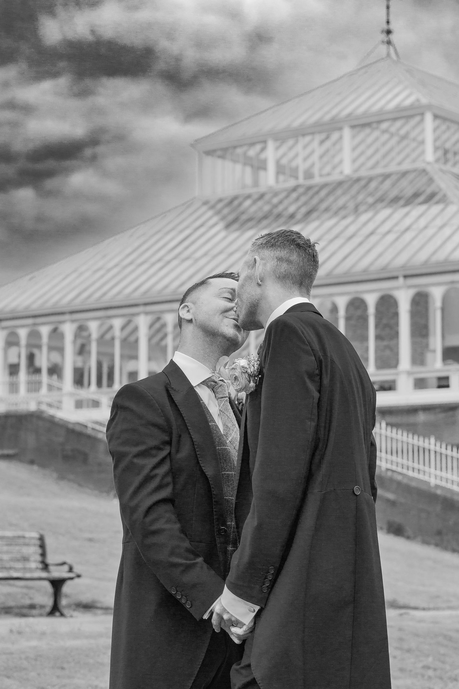 Black and white photos showing playful moments outdoors with historic buildings in background.