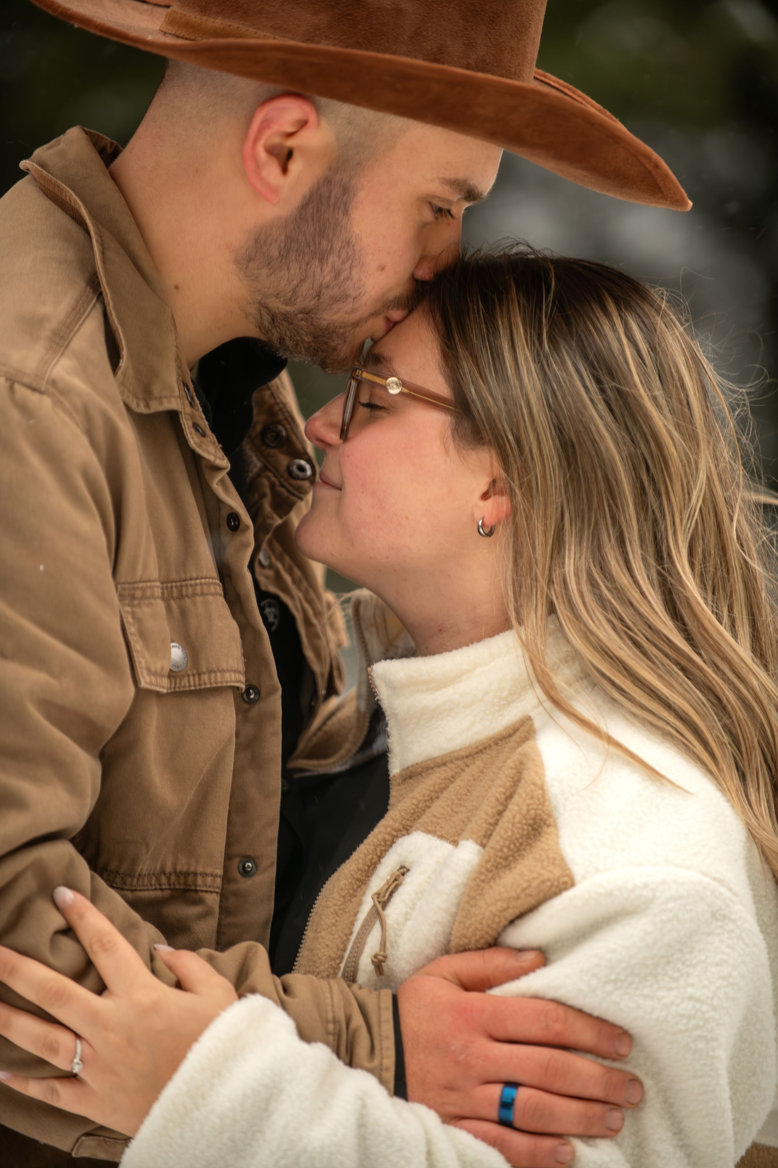 A romantic couple in brown and white outfits share an intimate moment in a series of connected photos.