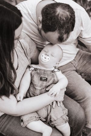 Black and white image of intimate family moments and embraces.