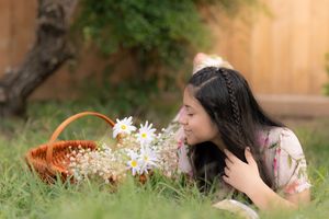 A series of photos showing a person photographing and interacting with a basket in a garden setting. In Pearland, TX