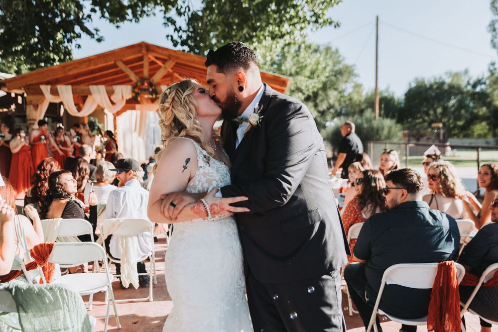 A wedding reception celebration with couple sharing their first dance outdoors.