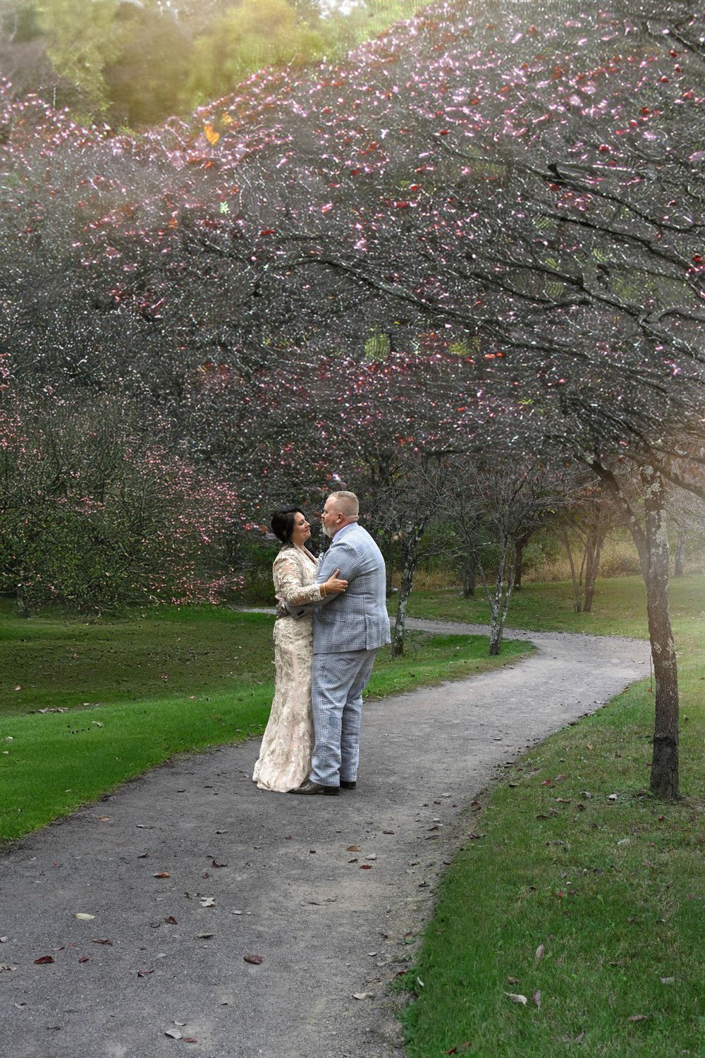 eloped couple dancing in fall trees