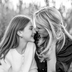 Black and white sentimental photograph series showing tender intimate moments between a mother and daughter.