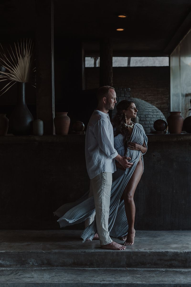 Couple maternity portraits in Tulum luxury resort jungle setting.